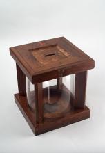 Wooden ballot box with clear glass jar in which ballots would have been put